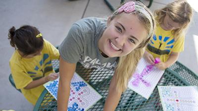 Maddie working with kids